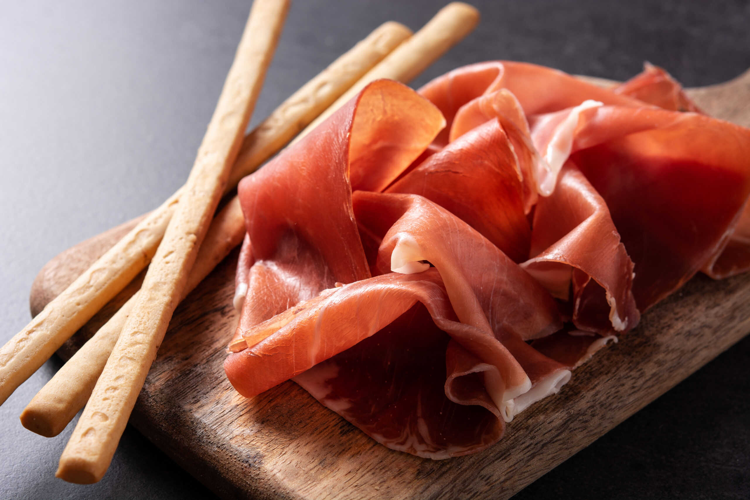 Spanish Serrano Ham With Olives And Breadstick